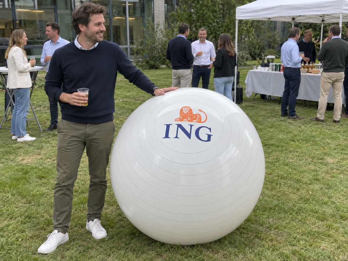 White giant ball with a company logo at an office garden party